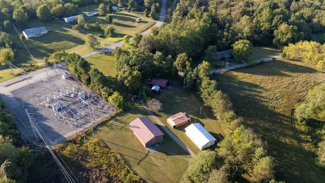 an aerial view of a house with a lake view