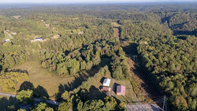 a view of a patio with a table and chairs