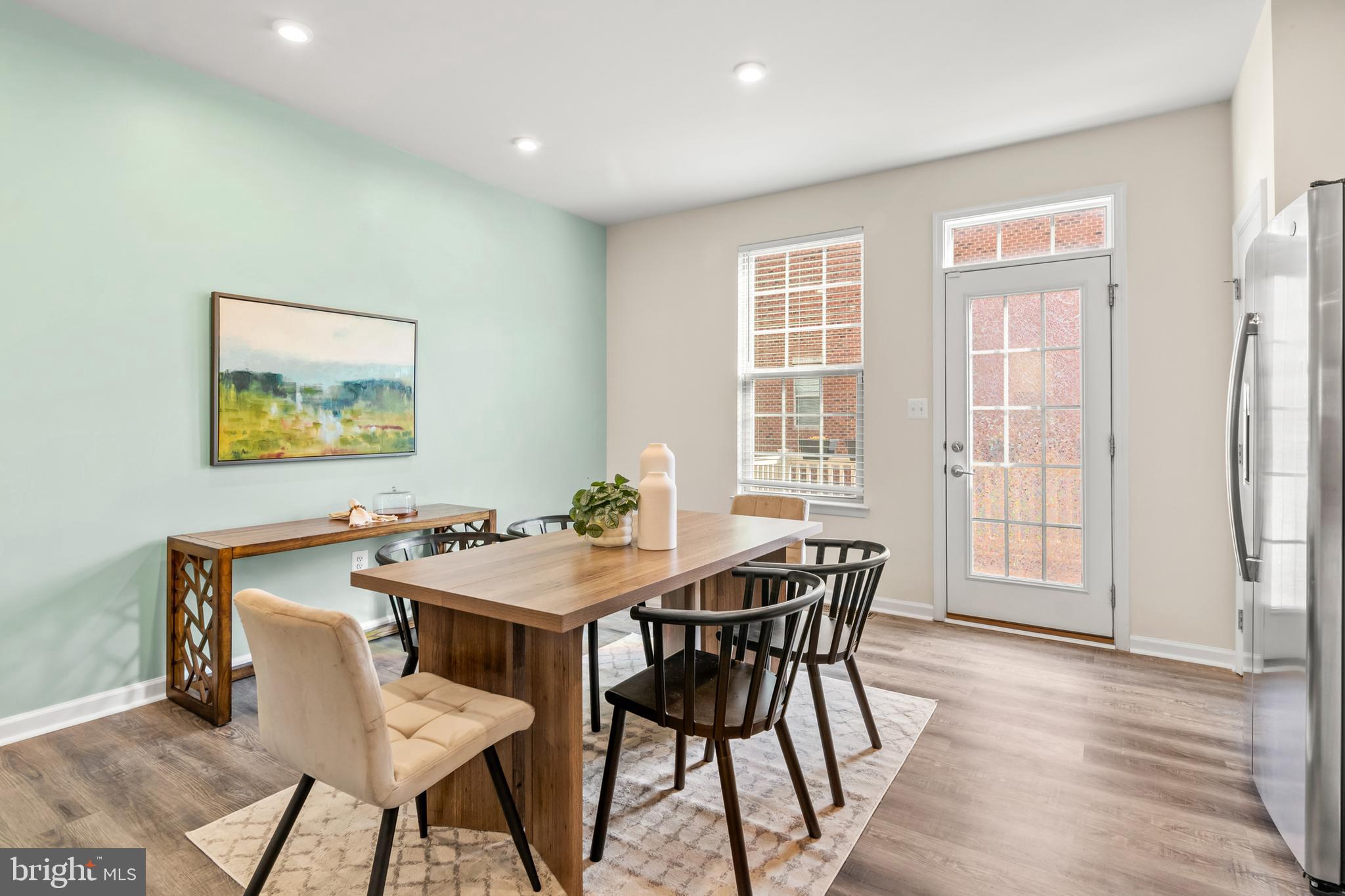 4701 Marlene Mews Baltimore, MD 21224 - Photo 12 of 39 a view of a dining room with furniture and wooden floor