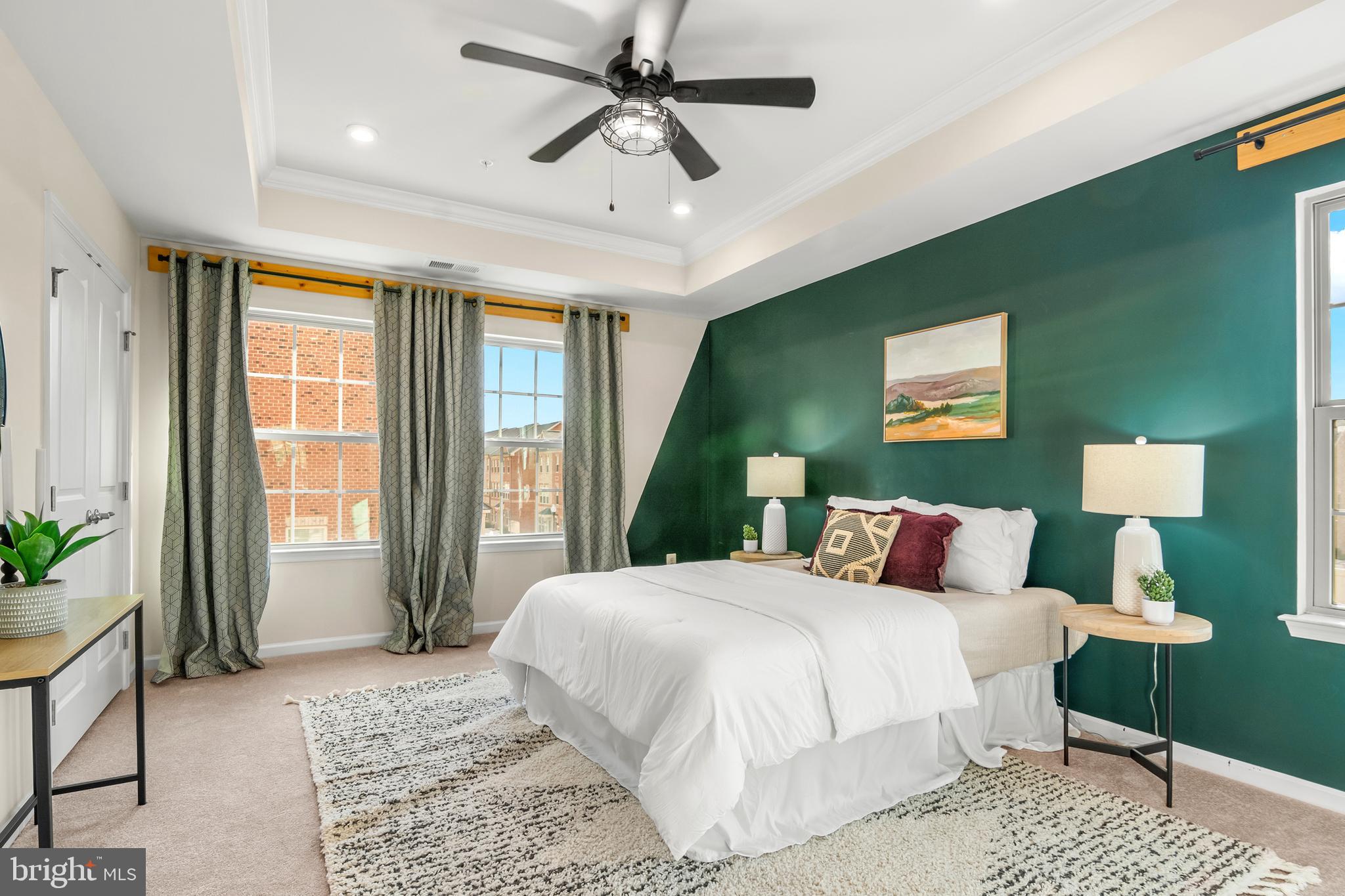 4701 Marlene Mews Baltimore, MD 21224 - Photo 20 of 39 a bedroom with a large bed and a chandelier