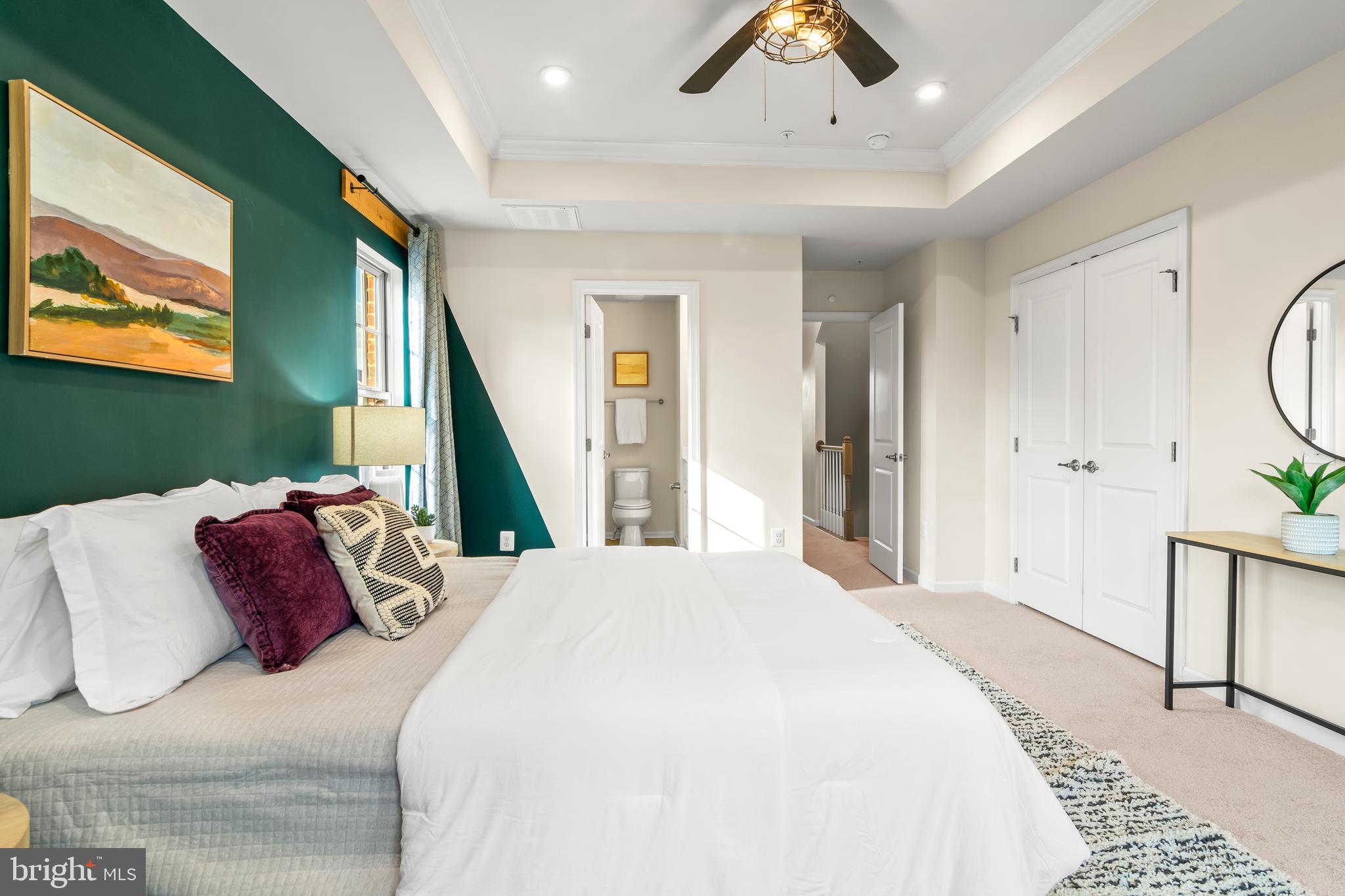 4701 Marlene Mews Baltimore, MD 21224 - Photo 22 of 39 a bedroom with a bed and a chandelier