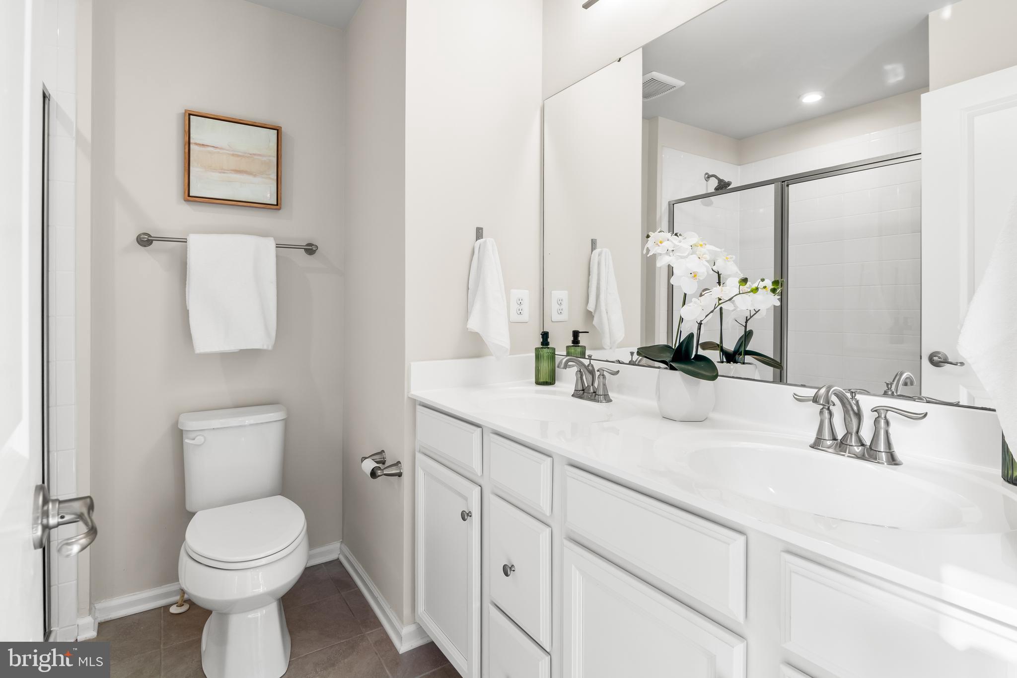 4701 Marlene Mews Baltimore, MD 21224 - Photo 23 of 39 a bathroom with a toilet sink and mirror