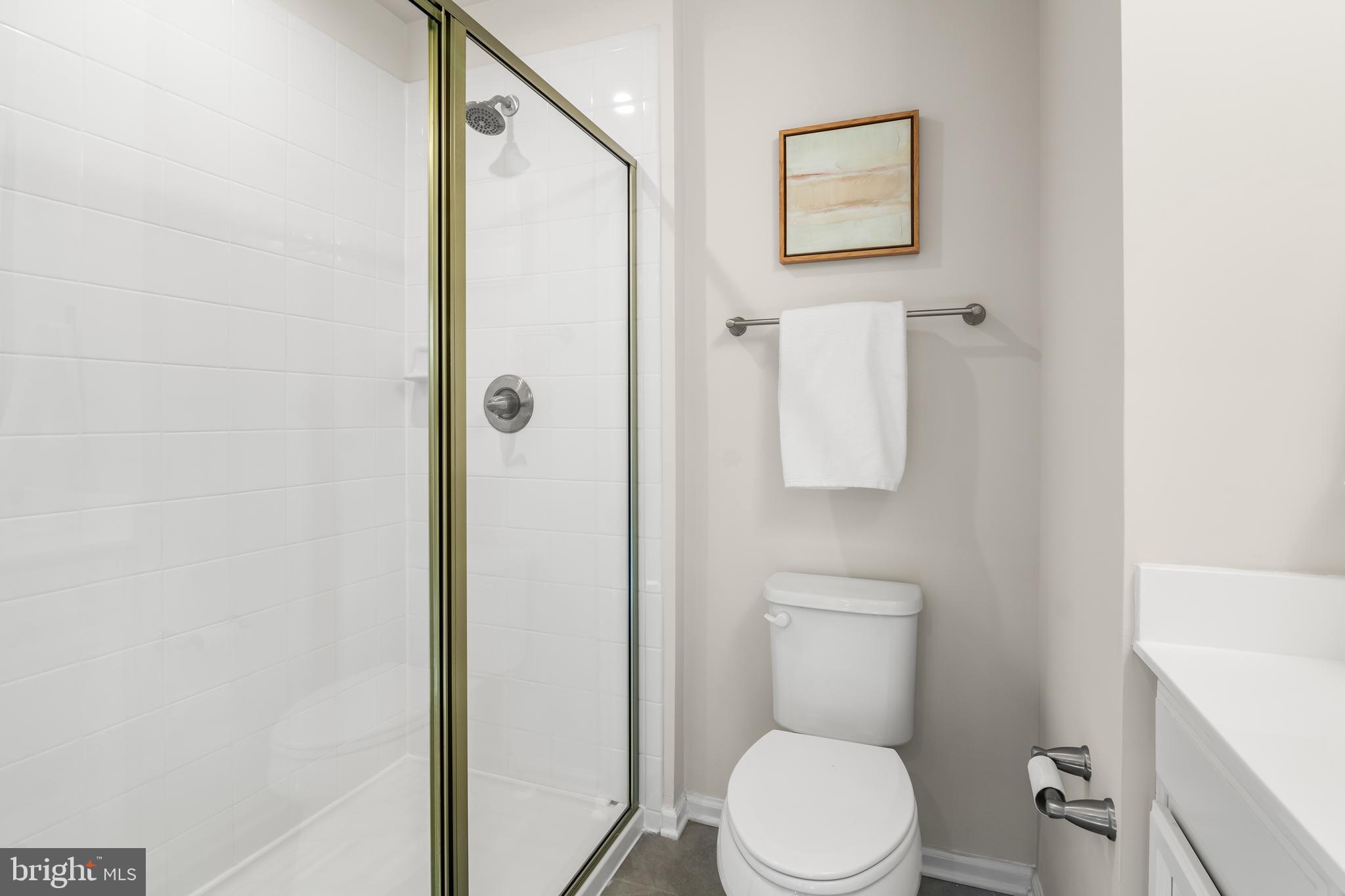 4701 Marlene Mews Baltimore, MD 21224 - Photo 24 of 39 a white toilet sitting next to a bathroom sink