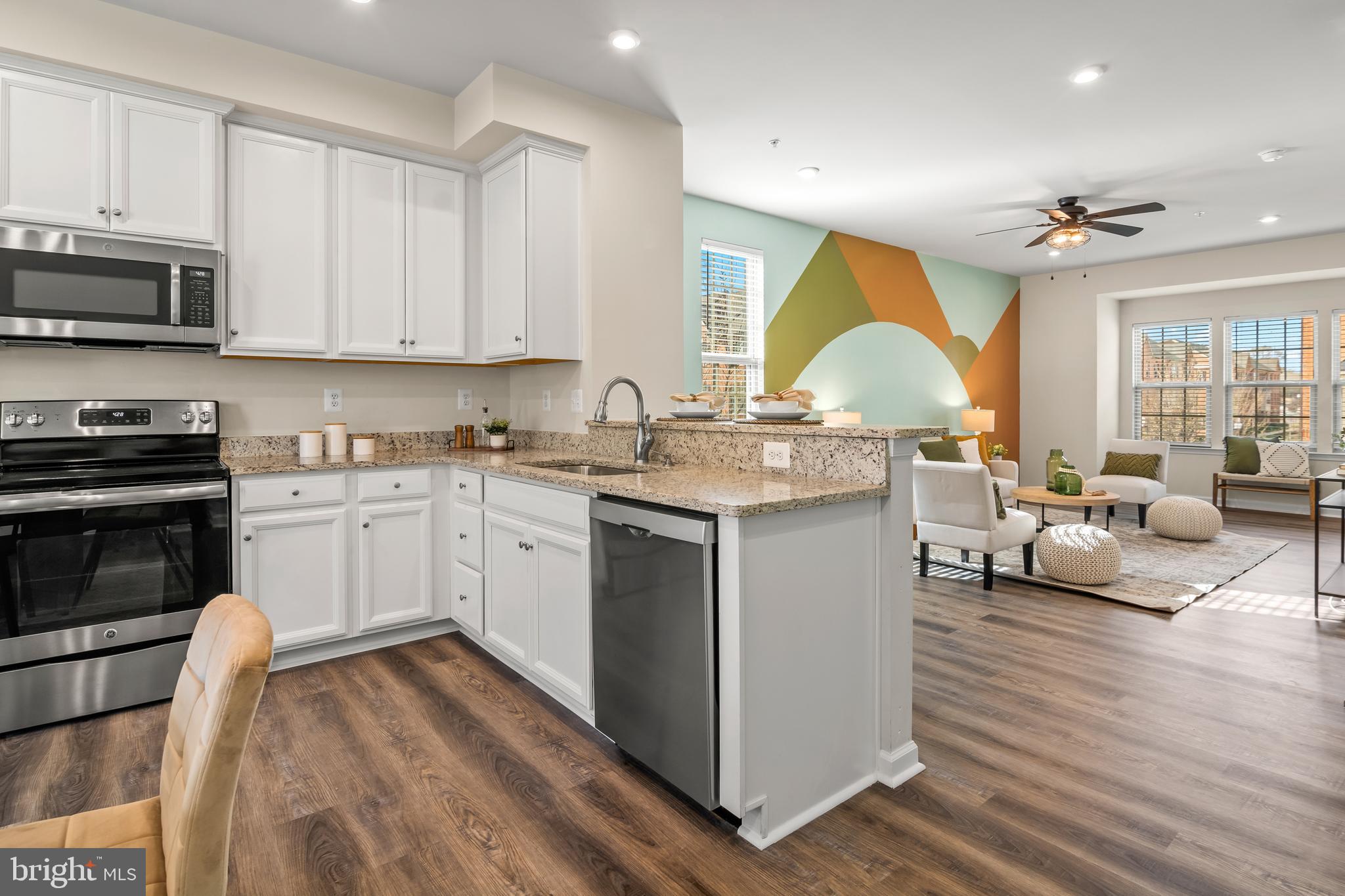 4701 Marlene Mews Baltimore, MD 21224 - Photo 7 of 39 a kitchen with a sink stove and cabinets