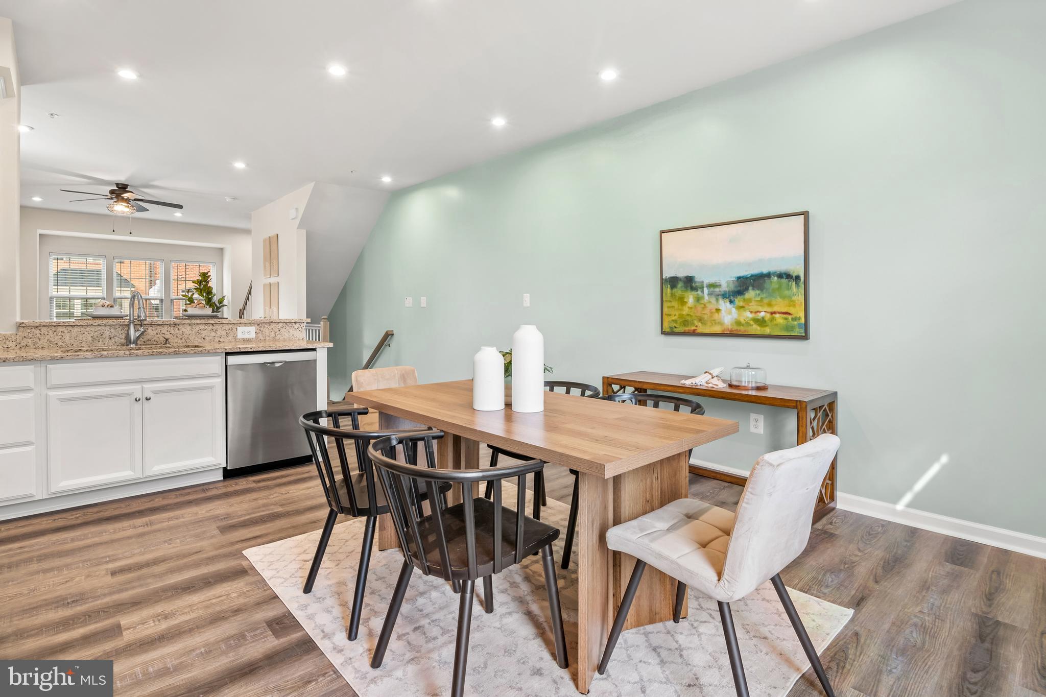 4701 Marlene Mews Baltimore, MD 21224 - Photo 9 of 39 a dining room with a wooden table and chairs