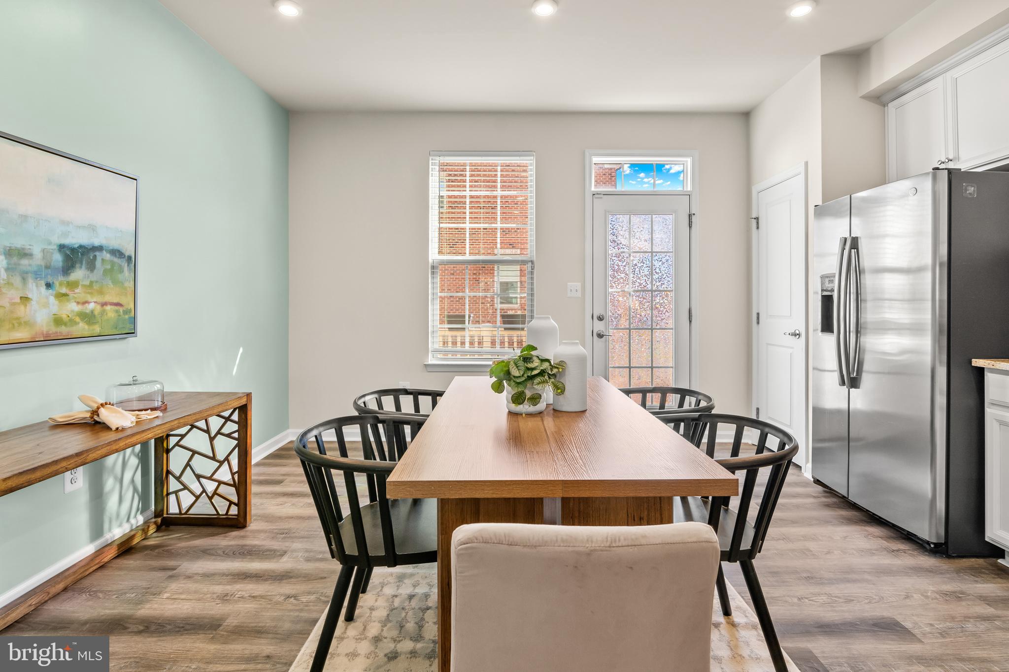 4701 Marlene Mews Baltimore, MD 21224 - Photo 10 of 39 a view of a dining room with furniture window and wooden floor