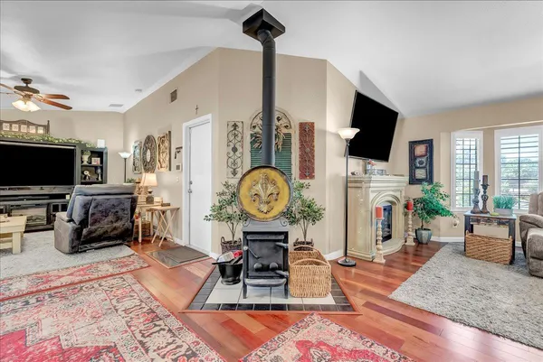 a living room with lots of furniture and kitchen view
