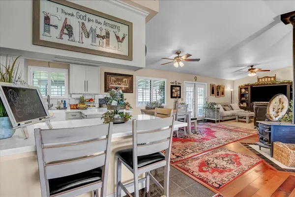 a view of a dining room with furniture and a table