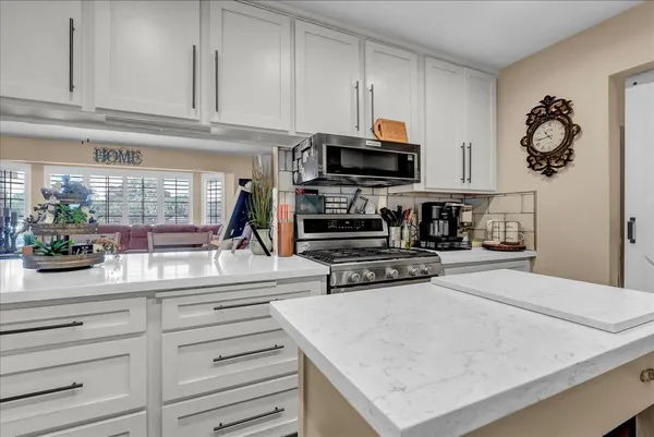 a kitchen with a sink stove and refrigerator