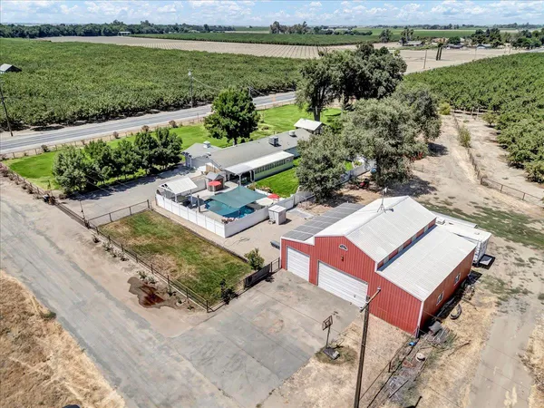 an aerial view of a houses with outdoor space