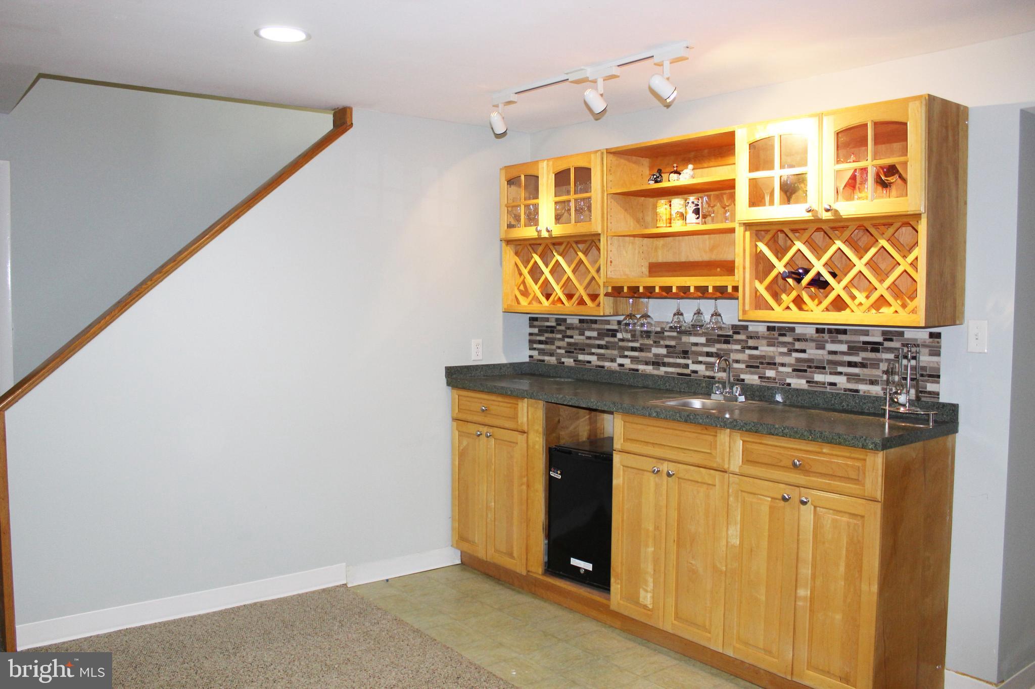 2 Thorburn Road Gaithersburg, MD 20878 - Photo 8 of 19 Entertainment Area & Wet Bar in Finished Basement