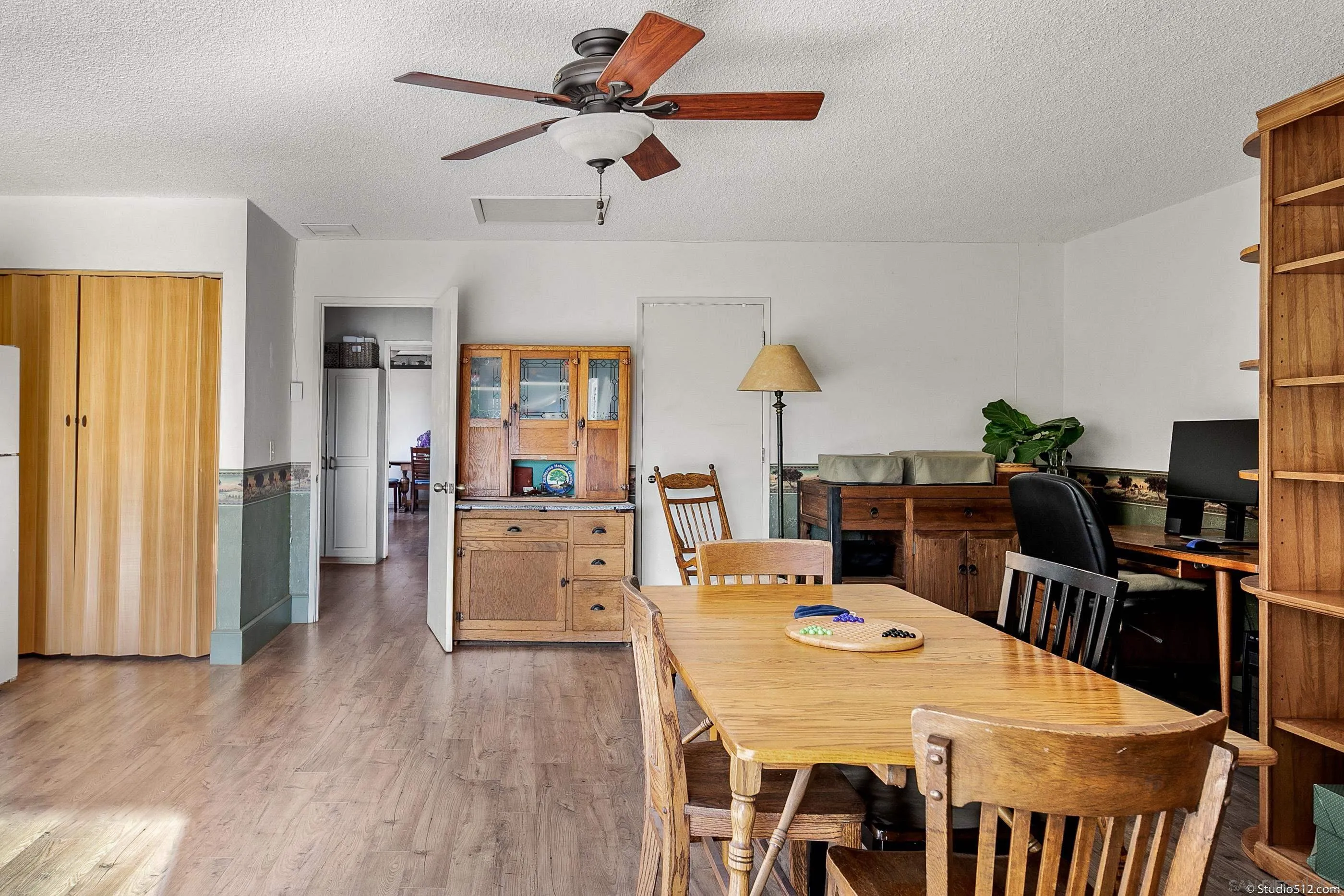 14847 Fruitvale Road Valley Center, CA 92082 - Photo 18 of 34 a dining room with stainless steel appliances a table and chairs