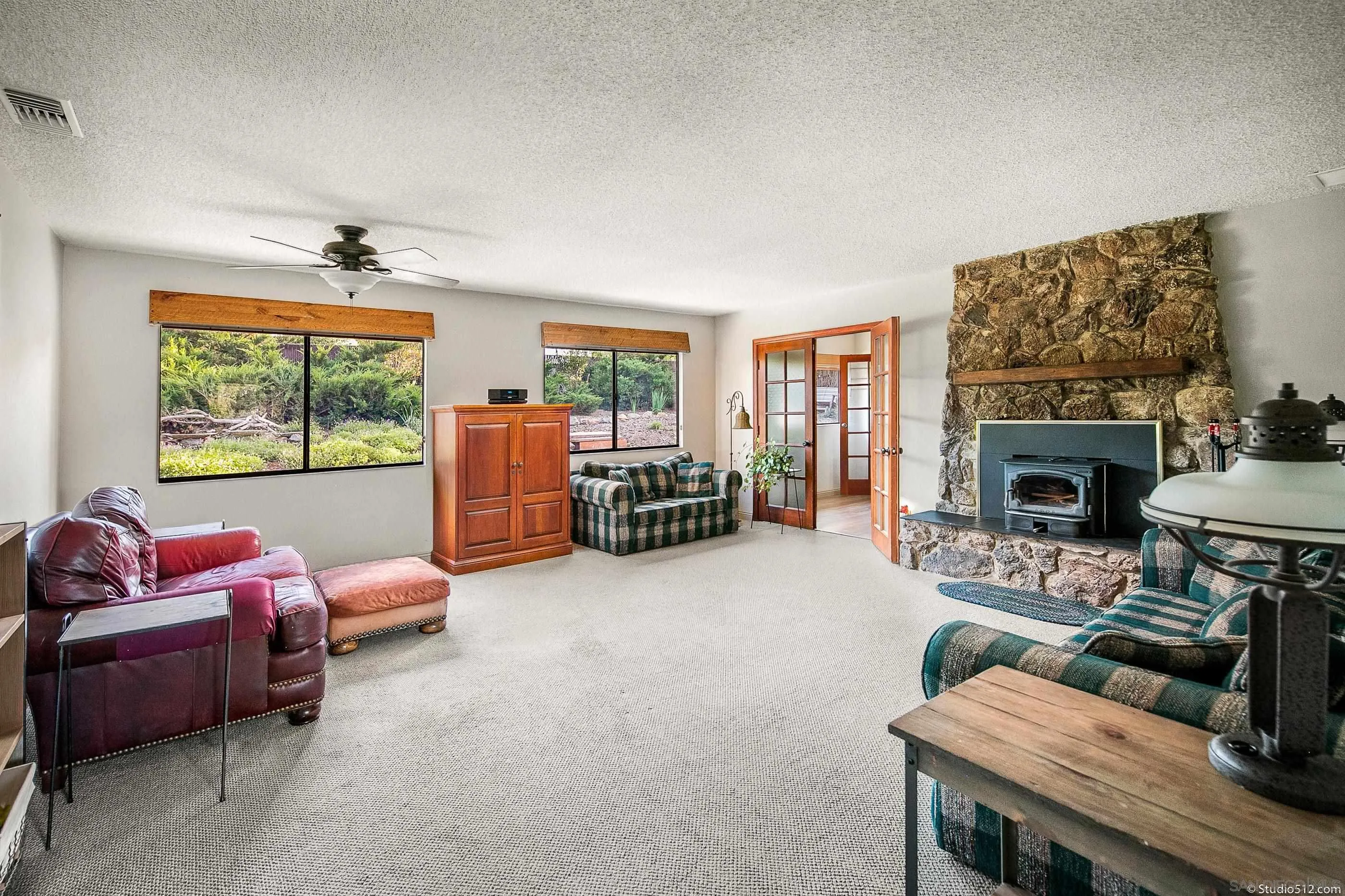 14847 Fruitvale Road Valley Center, CA 92082 - Photo 10 of 34 a living room with furniture and a fireplace