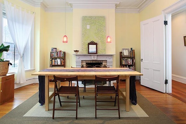 17 High Street, Unit 2 Brookline, MA 02445 - Photo 1 of 6 a dining room with a wooden table and chairs