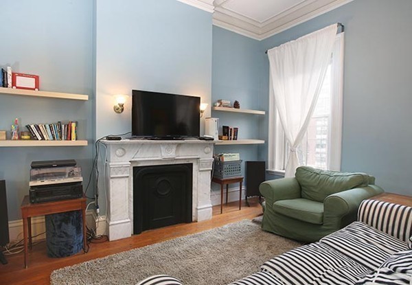 17 High Street, Unit 2 Brookline, MA 02445 - Photo 2 of 6 a living room with furniture a flat screen tv and a fireplace