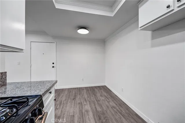 a view of a kitchen cabinets and wooden floor