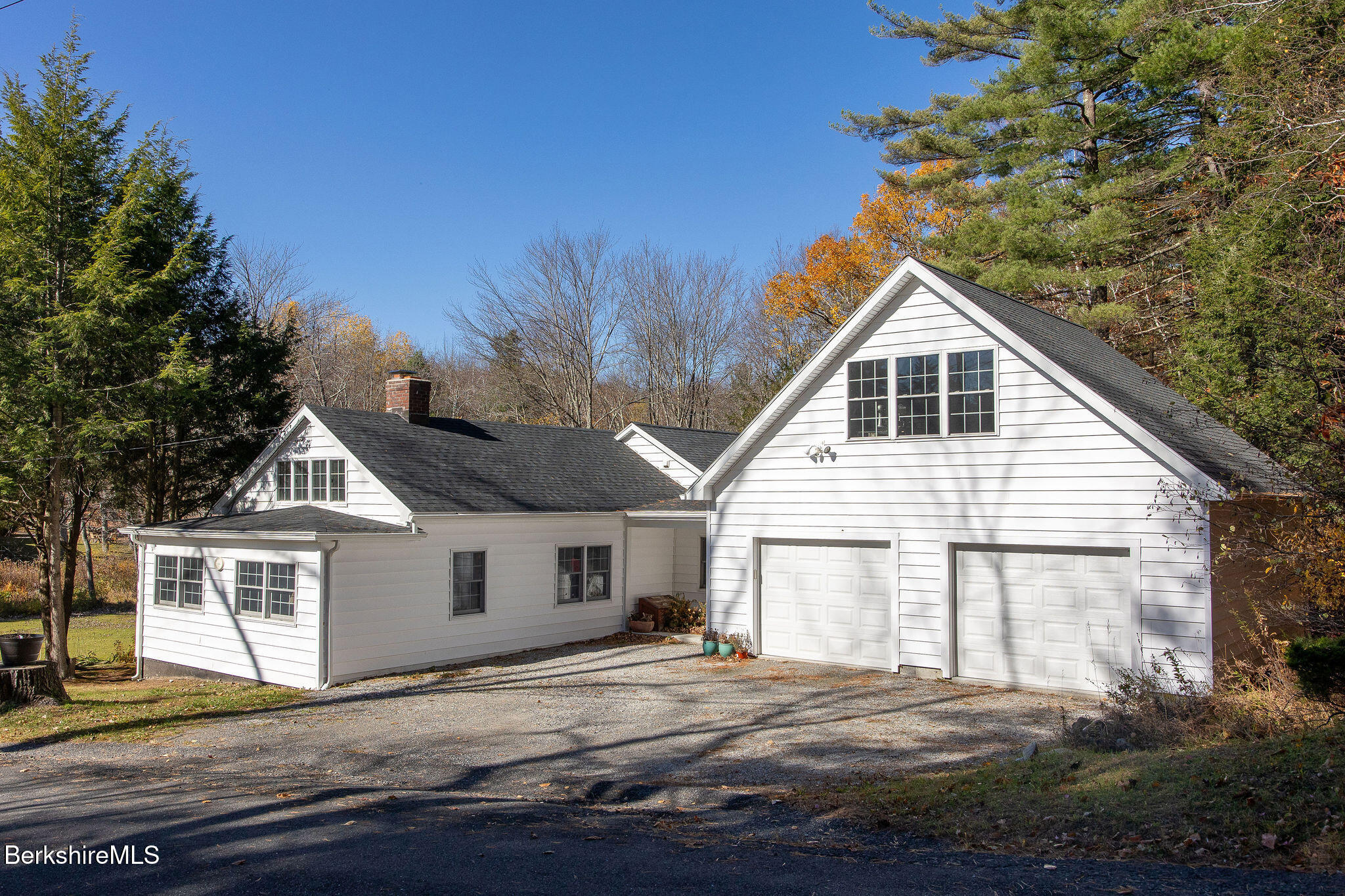 128 Ymca Road Becket, MA 01223 - Photo 1 of 23 a front view of a house with a garage