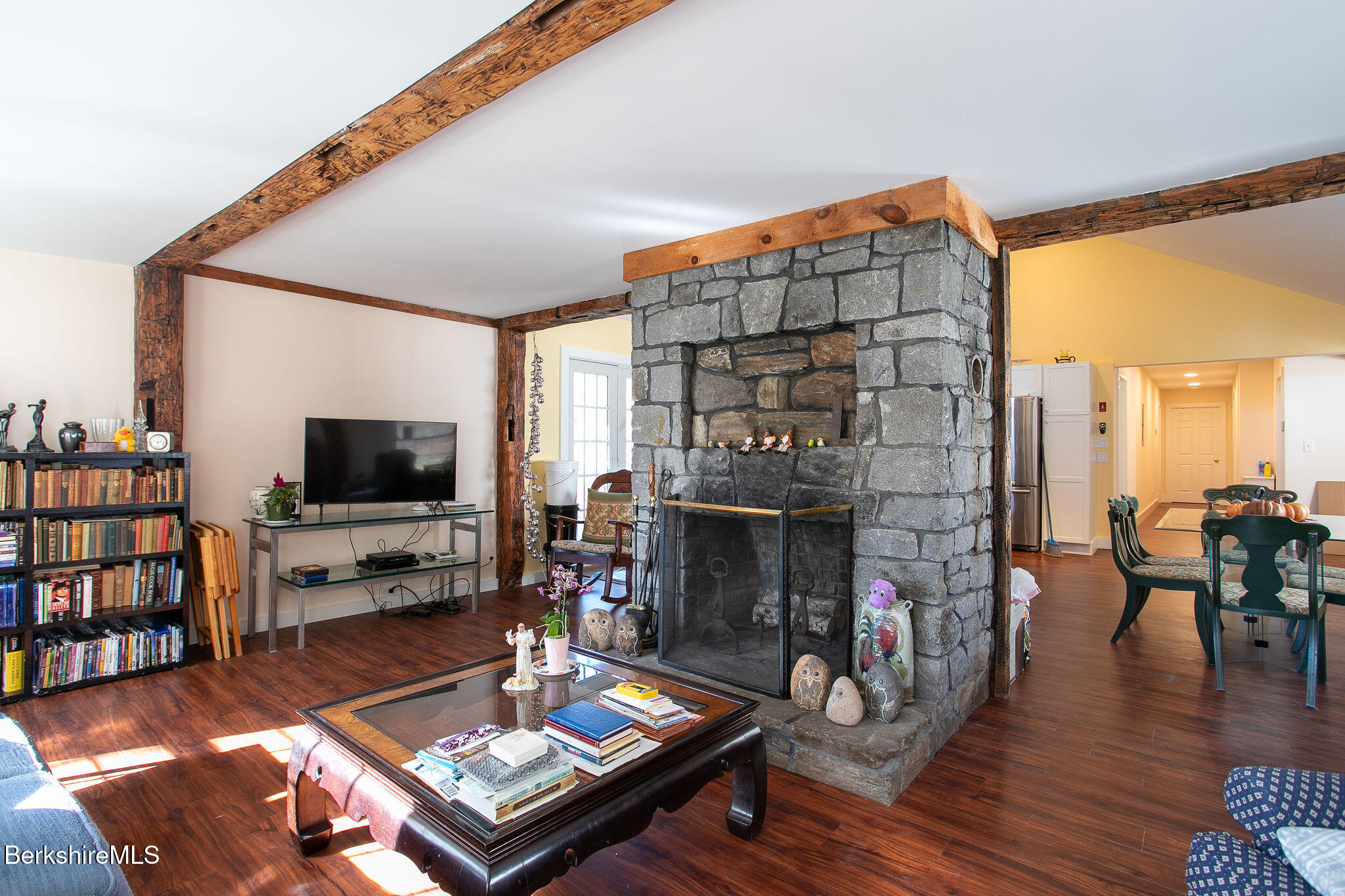 128 Ymca Road Becket, MA 01223 - Photo 7 of 23 a living room with furniture a flat screen tv and a fireplace