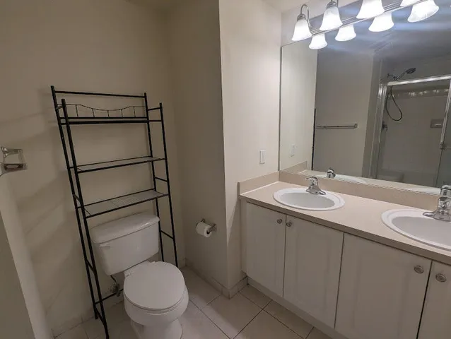 a view of an empty room with stairs and ventilation