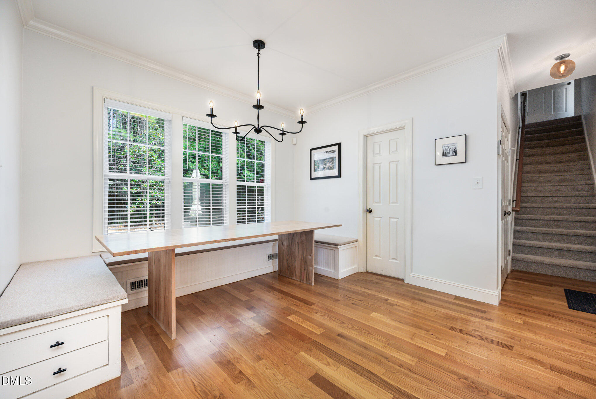 1613 Strategy Way Wake Forest, NC 27587 - Photo 7 of 40 a large room with a window and wooden floor