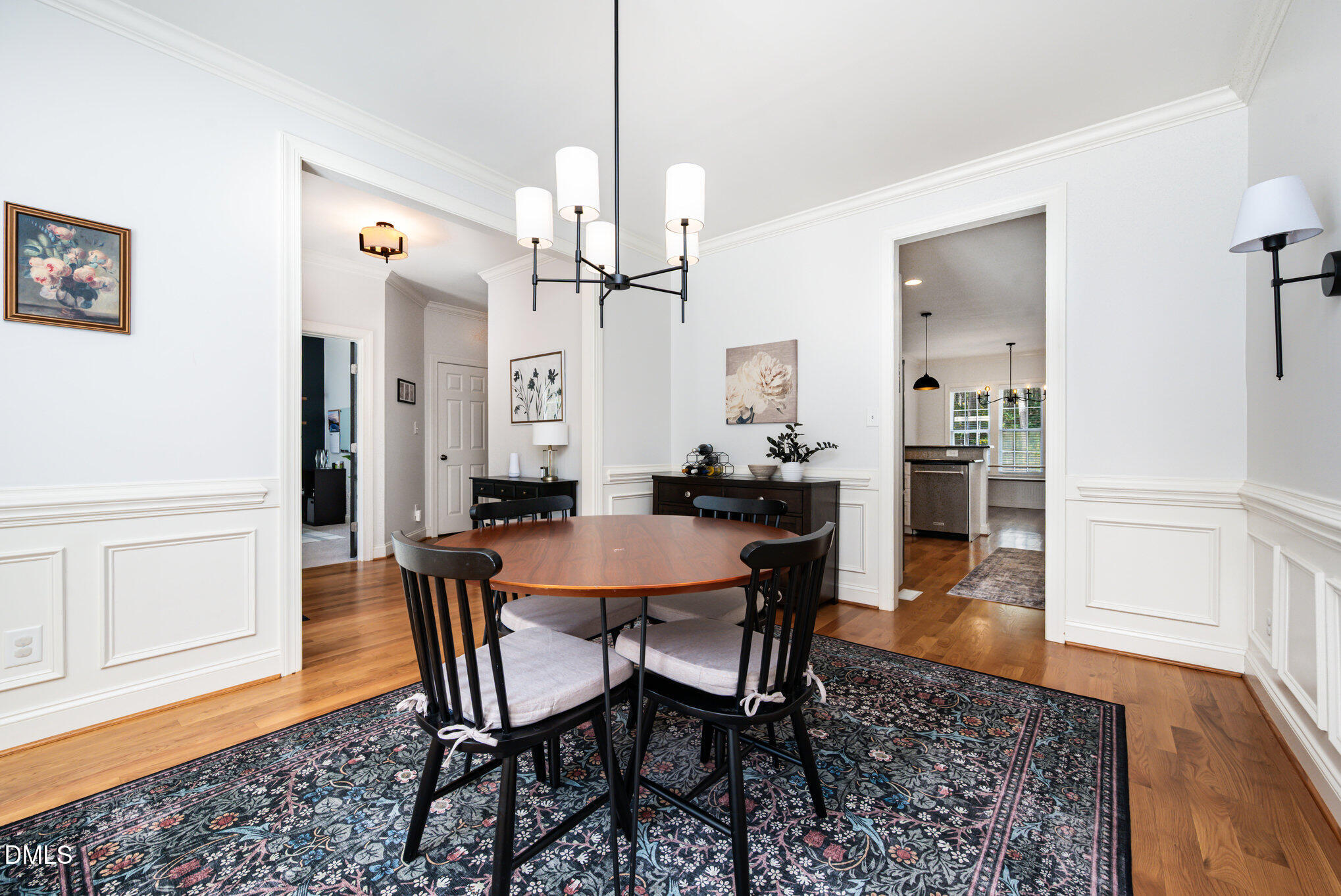 1613 Strategy Way Wake Forest, NC 27587 - Photo 9 of 40 a view of a dining room with furniture and wooden floor