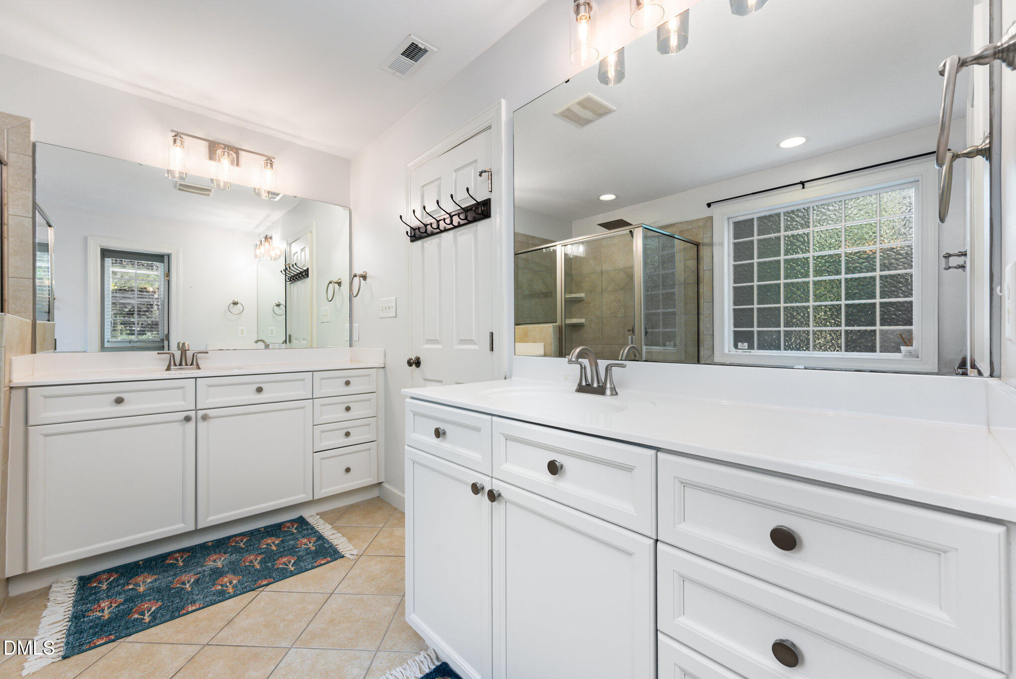 1613 Strategy Way Wake Forest, NC 27587 - Photo 18 of 40 a bathroom with a sink vanity and mirror