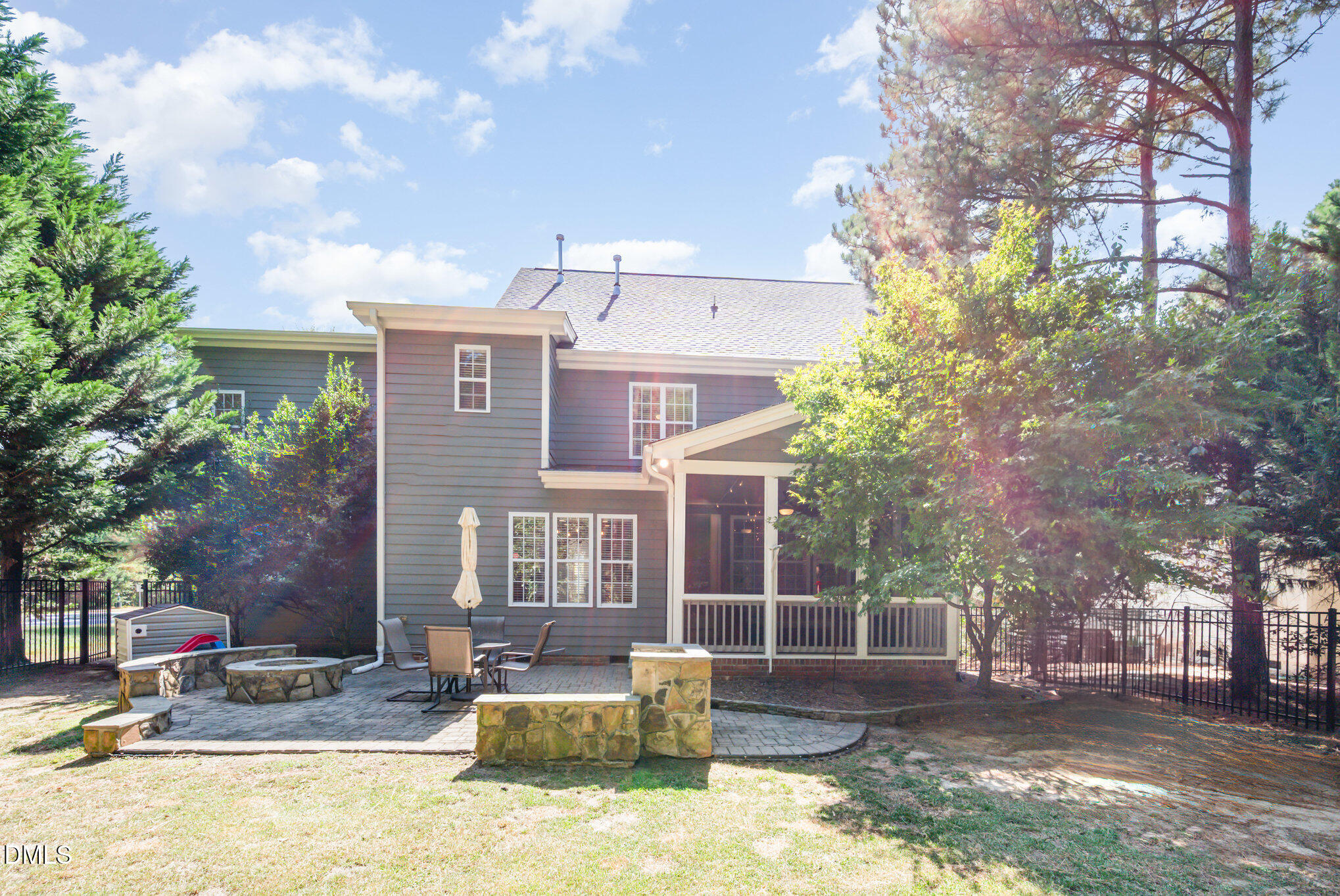 1613 Strategy Way Wake Forest, NC 27587 - Photo 25 of 40 a brick house with large trees and outdoor space