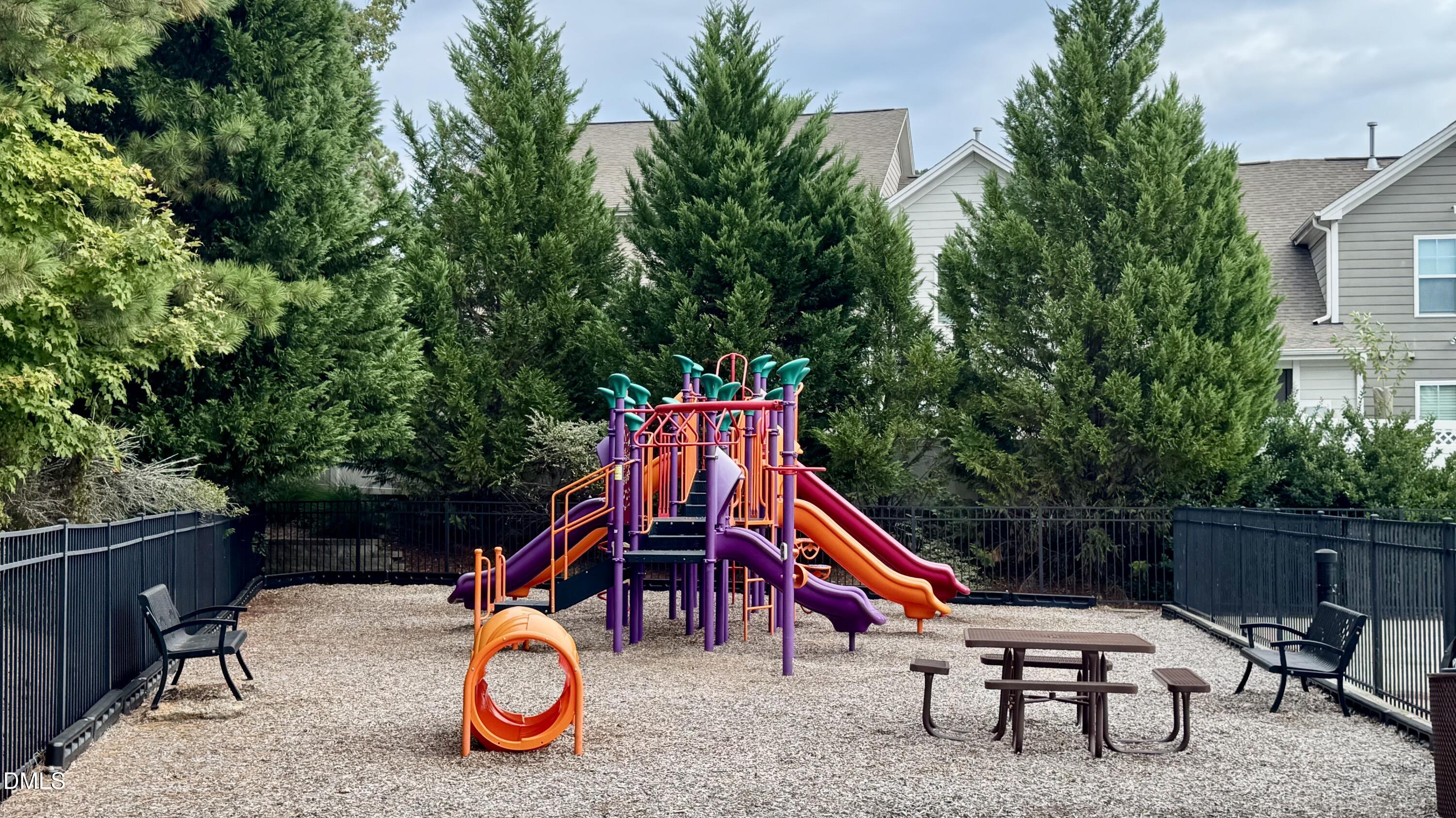1613 Strategy Way Wake Forest, NC 27587 - Photo 33 of 40 a wooden bench sitting in a backyard