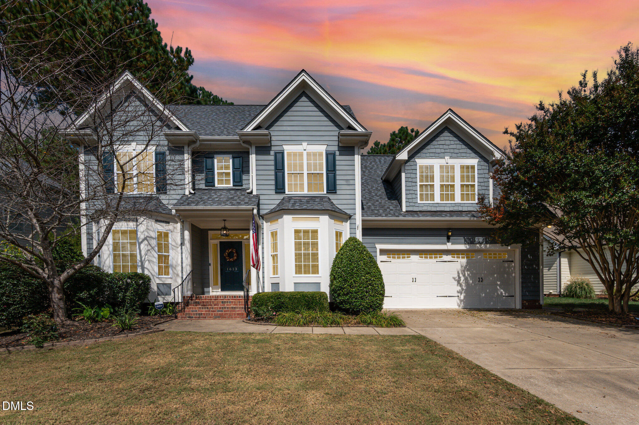 1613 Strategy Way Wake Forest, NC 27587 - Photo 34 of 40 a front view of a house with a yard and garage