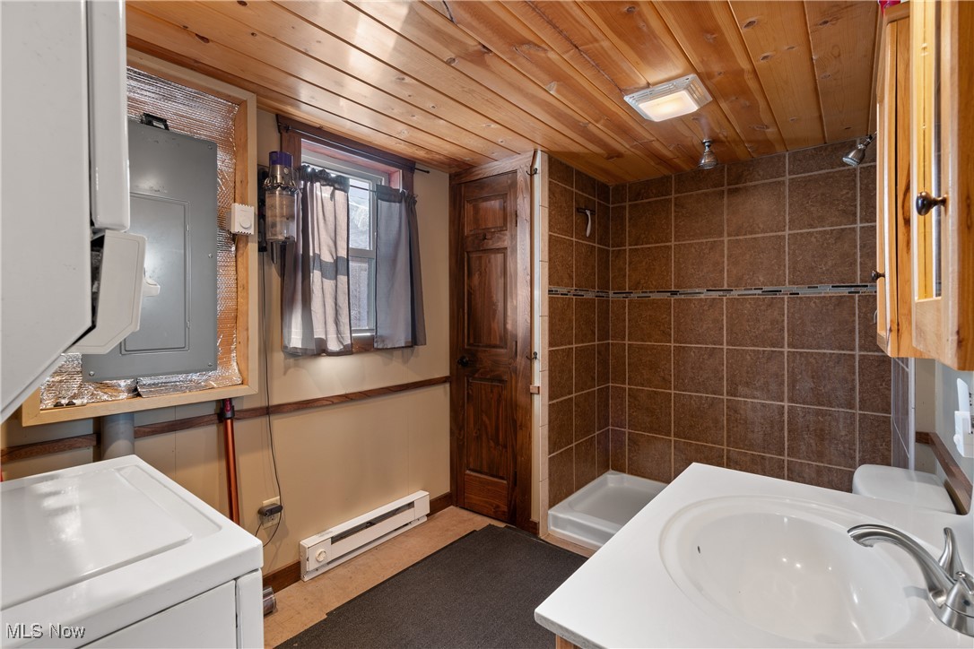 35620 Egypt North Road Barnesville, OH 43713 - Photo 28 of 41 View of bathroom area on main floor featuring laundry area