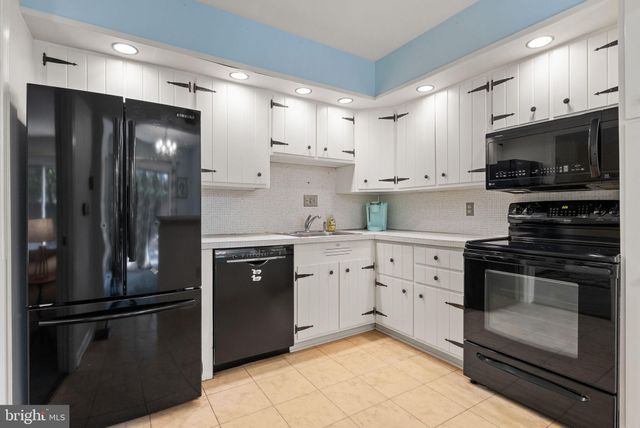 an empty room with windows and outdoor view