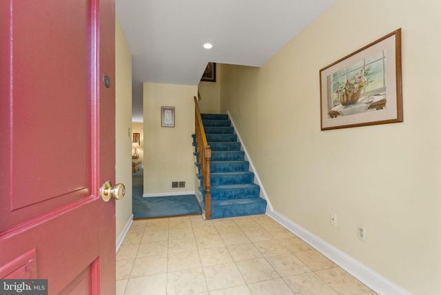 a view of a hallway with staircase