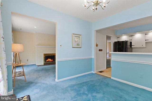 a picture of a bench in front of a wall