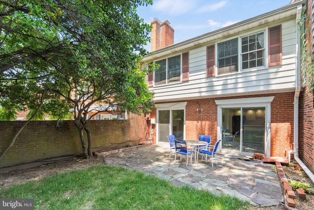 a room with stairs and a view of living room