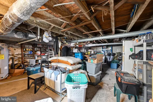 a view of a storage room with a table and chairs