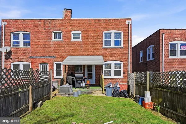 a view of a backyard with a tree