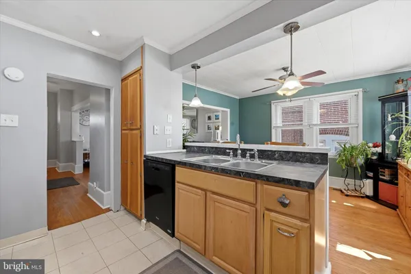 a bathroom with a granite countertop sink a mirror and a shower