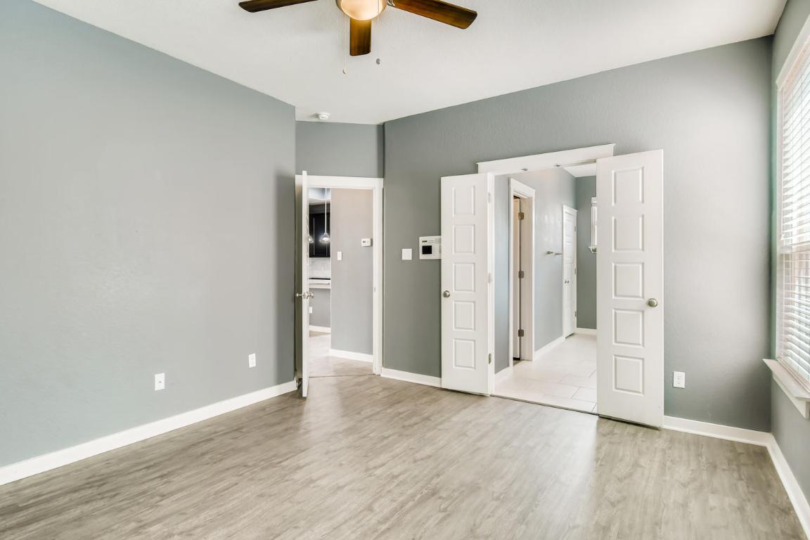16229 Travesia Way Austin, TX 78728 - Photo 14 of 28 a view of empty room with wooden floor