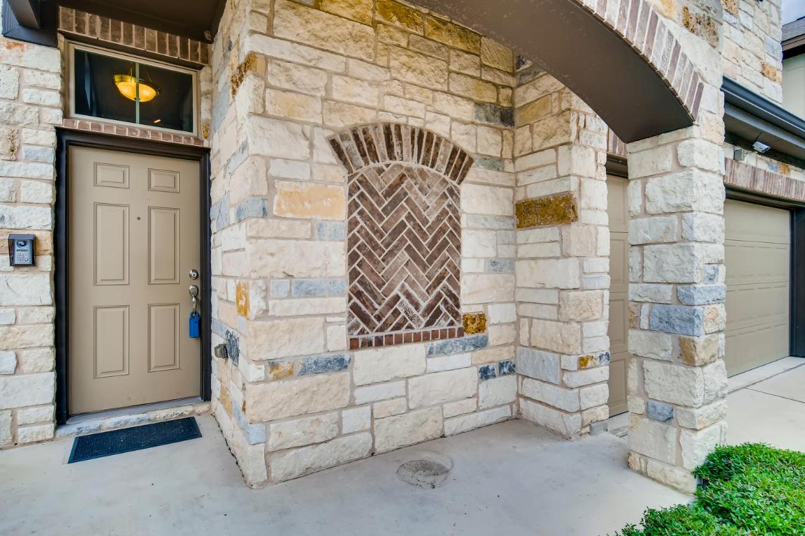 16229 Travesia Way Austin, TX 78728 - Photo 3 of 28 a view of entryway with a brick wall