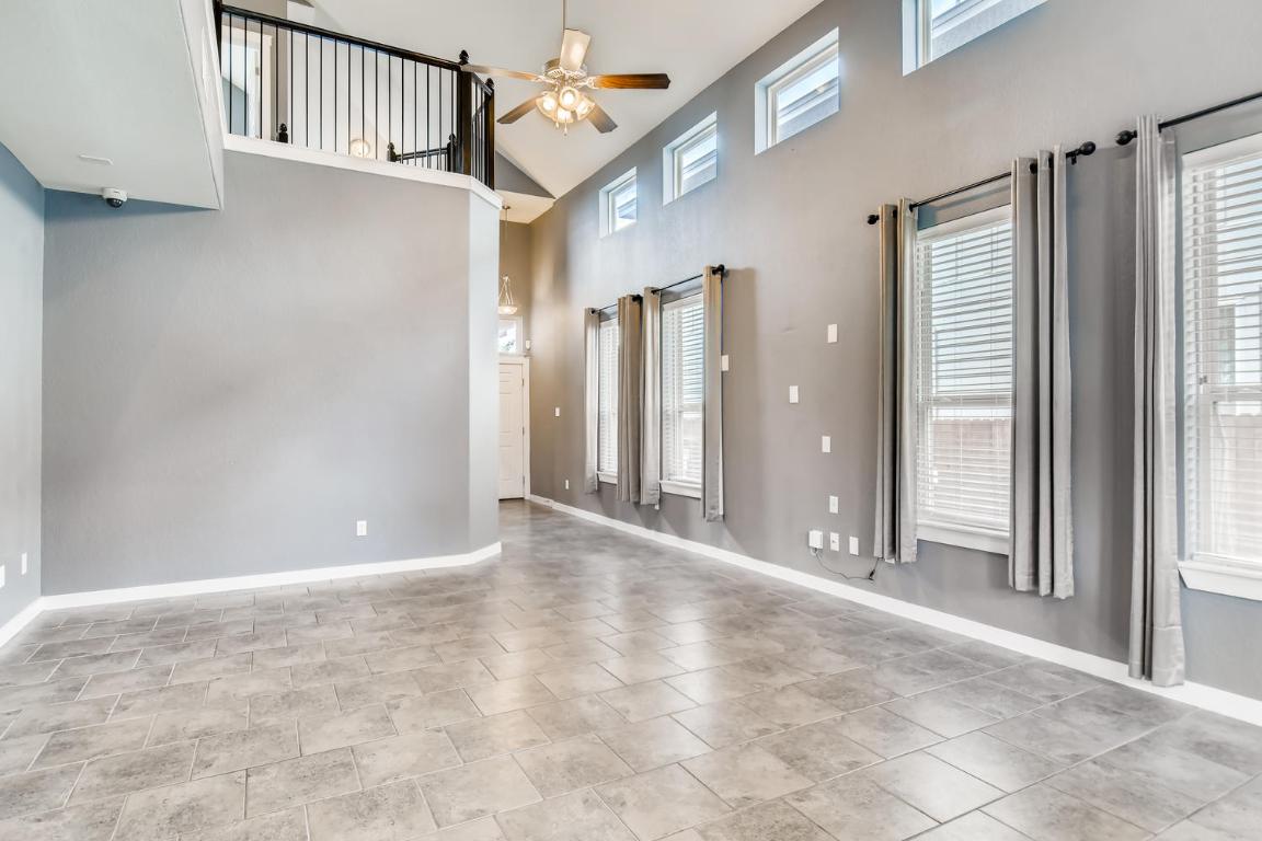 16229 Travesia Way Austin, TX 78728 - Photo 5 of 28 a view of a hallway with wooden floor and staircase