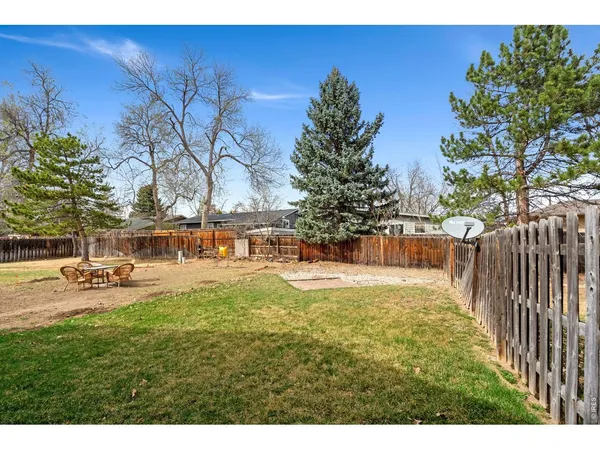 a view of a backyard with swimming pool