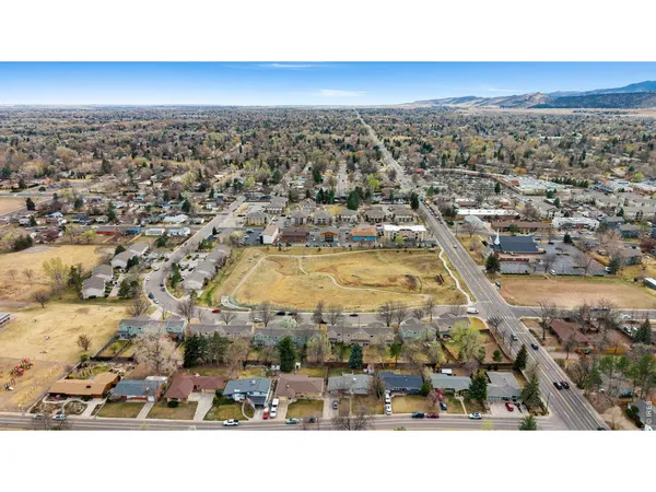 an aerial view of residential building and ocean view