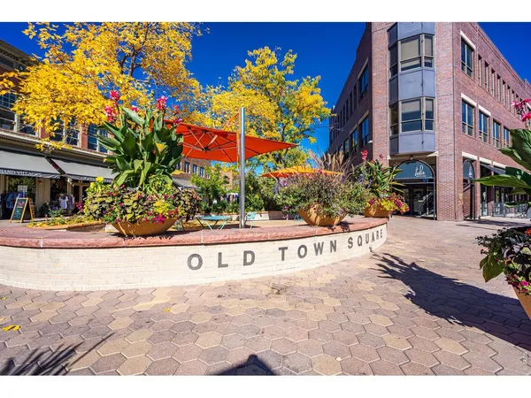 a view of swimming pool with a bench in front of house