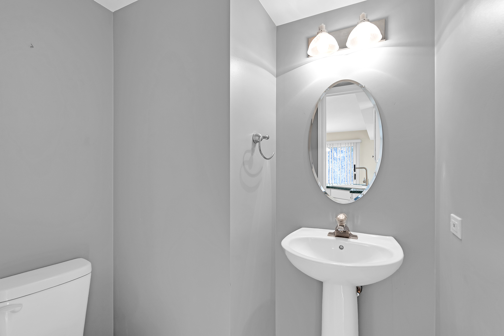 148 Locksley Drive Streamwood, IL 60107 - Photo 14 of 20 a bathroom with a sink and mirror