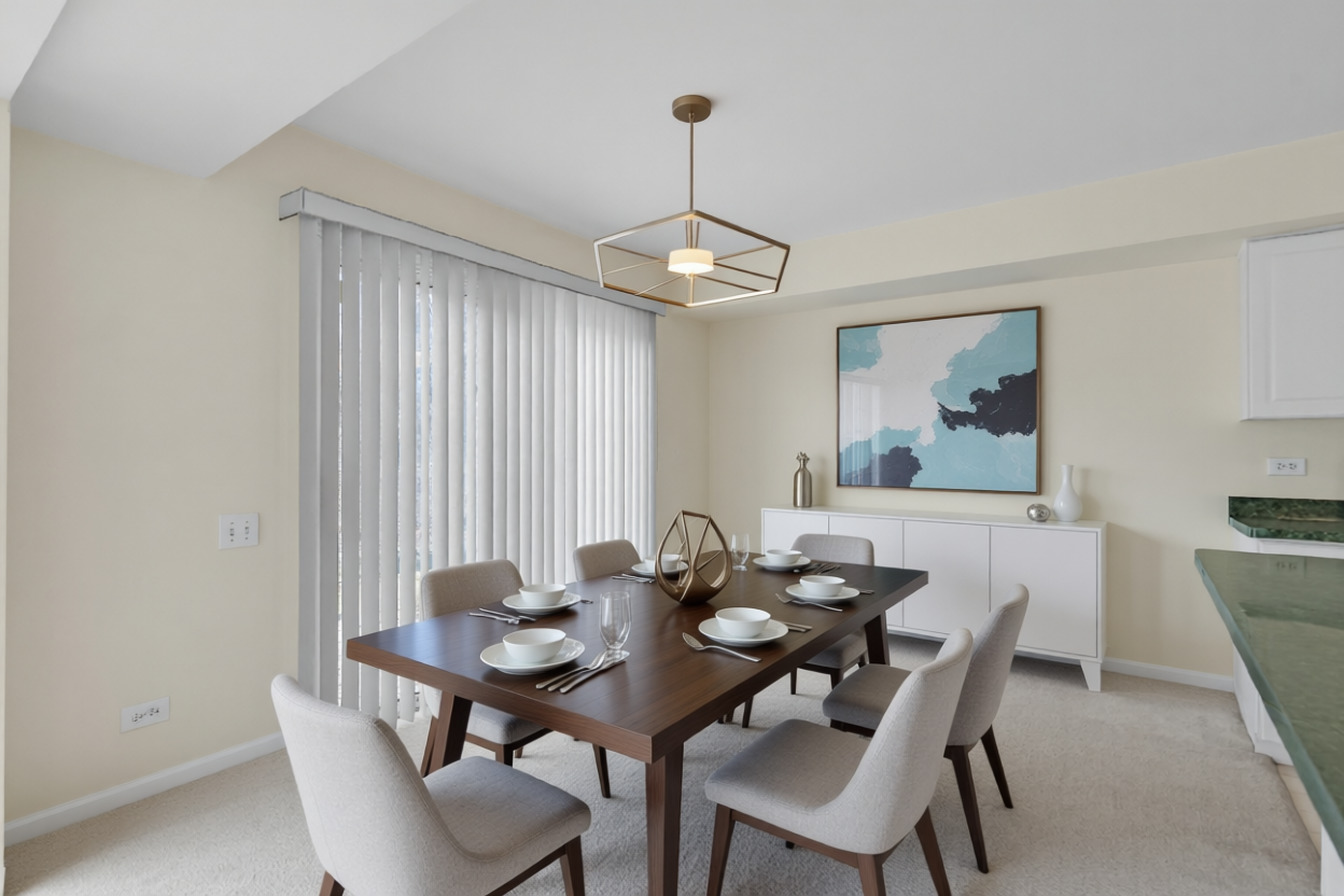 148 Locksley Drive Streamwood, IL 60107 - Photo 5 of 20 a view of a dining room with furniture and chandelier