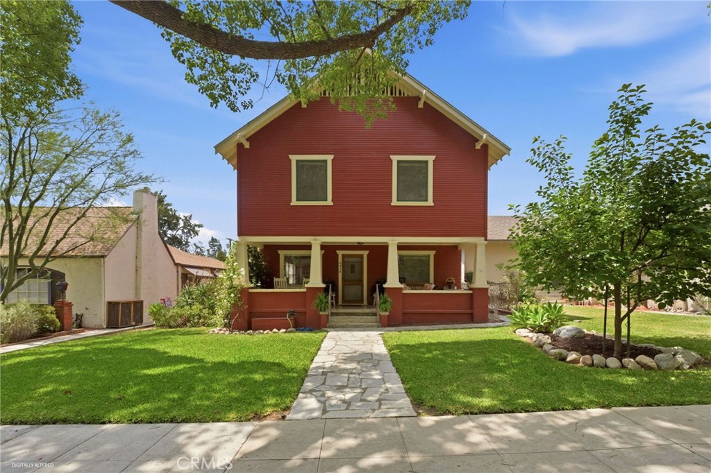 4456 12th Street Riverside, CA 92501 - Photo 1 of 70 front view of house with a yard