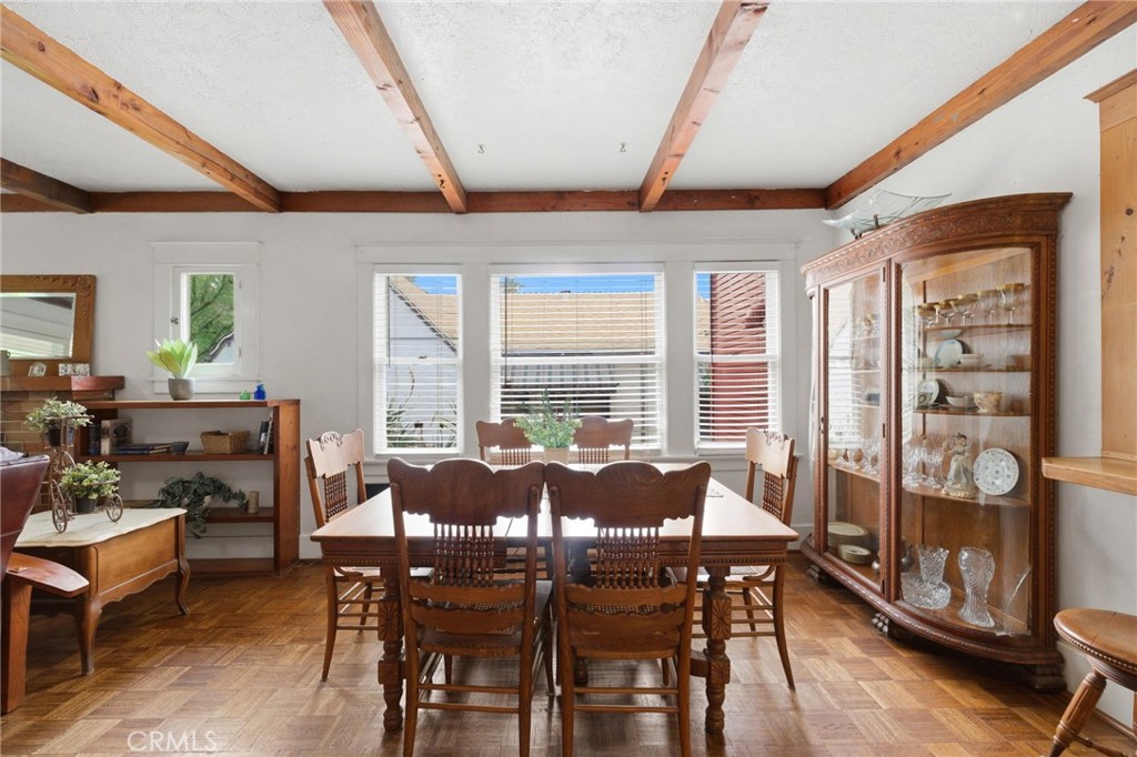 4456 12th Street Riverside, CA 92501 - Photo 11 of 70 a dining room with furniture a chandelier and wooden floor