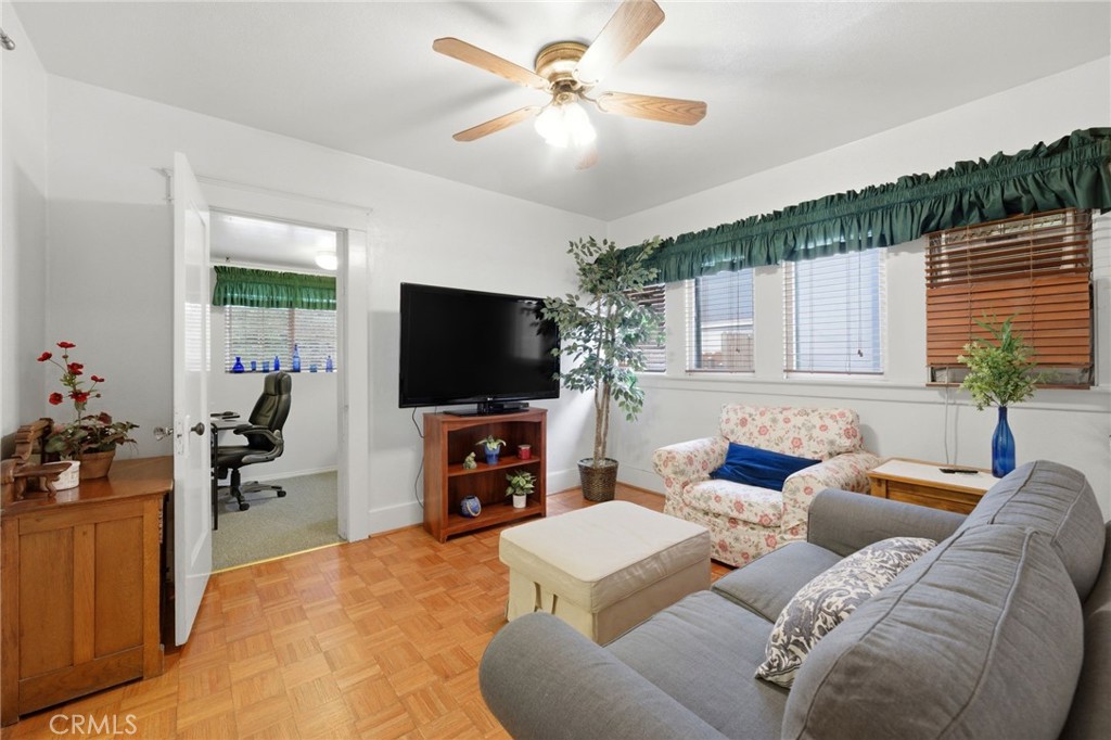4456 12th Street Riverside, CA 92501 - Photo 21 of 70 a living room with furniture and a flat screen tv