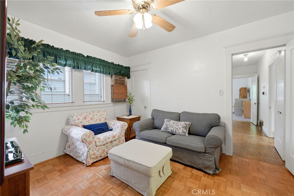 4456 12th Street Riverside, CA 92501 - Photo 22 of 70 a living room with furniture and a chandelier