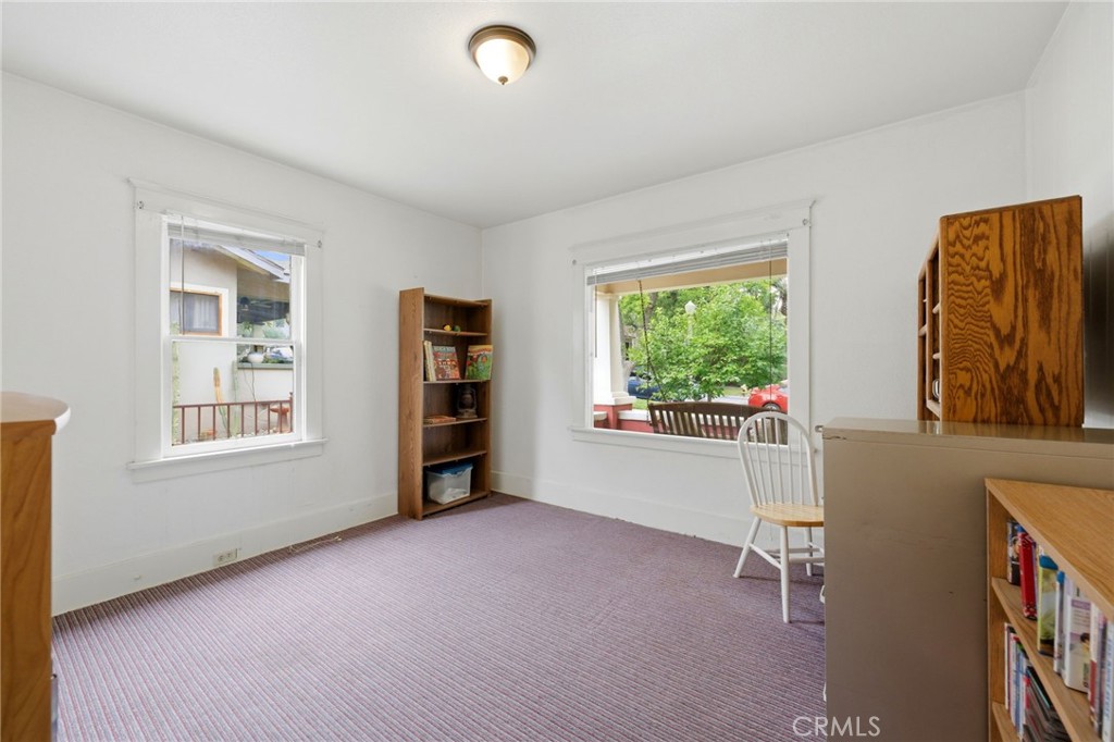 4456 12th Street Riverside, CA 92501 - Photo 26 of 70 a view of a bedroom with furniture and windows